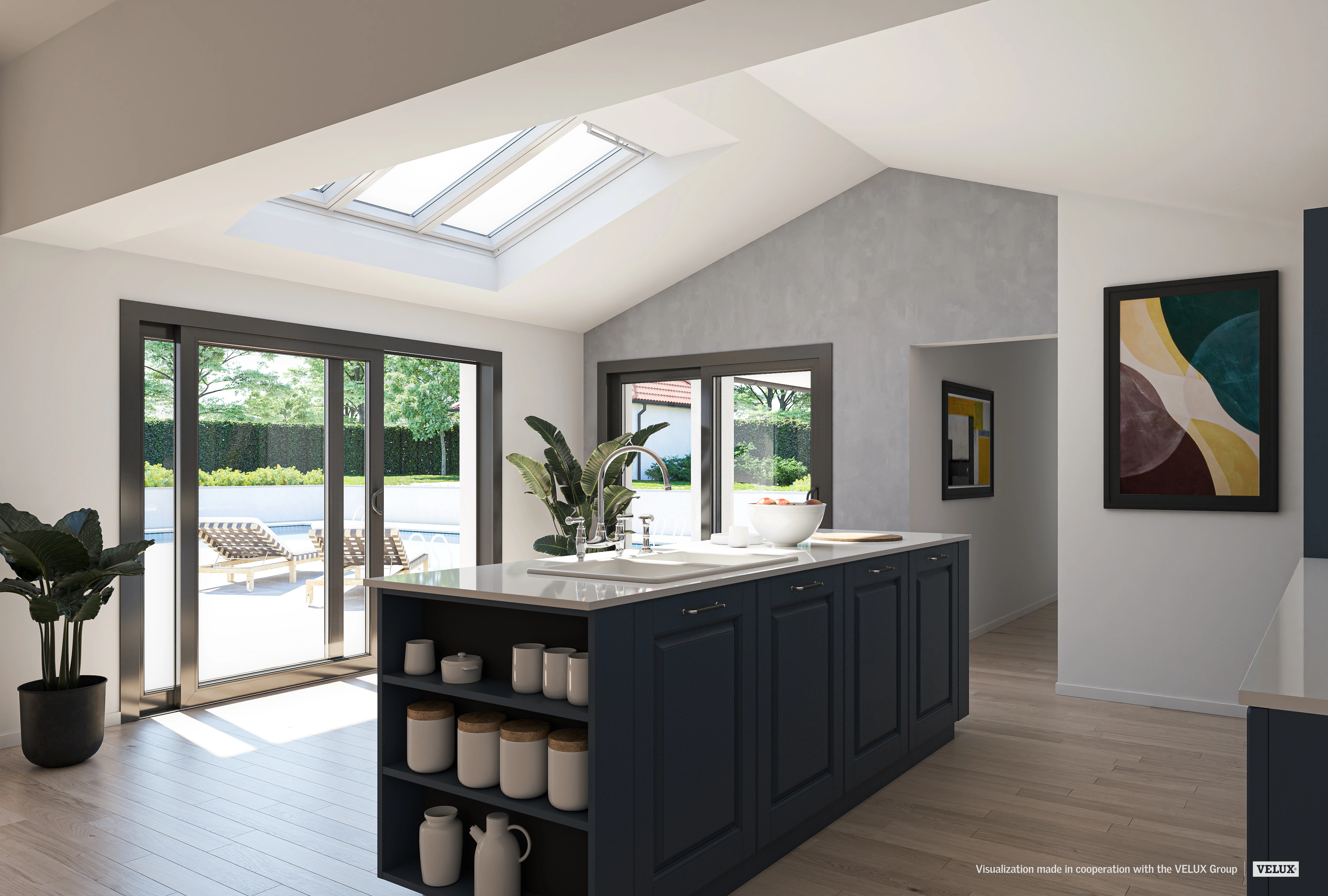 Cuisine avec fenêtres de toit, mobilier moderne et plantes vertes.