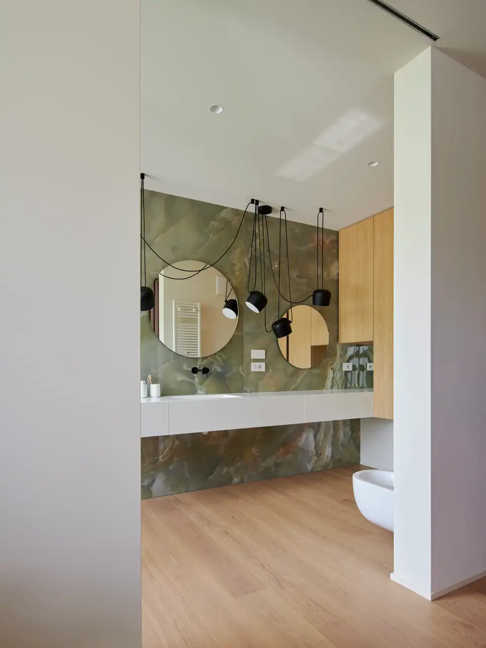 Elegant bathroom decor with stylish lighting and mirrors