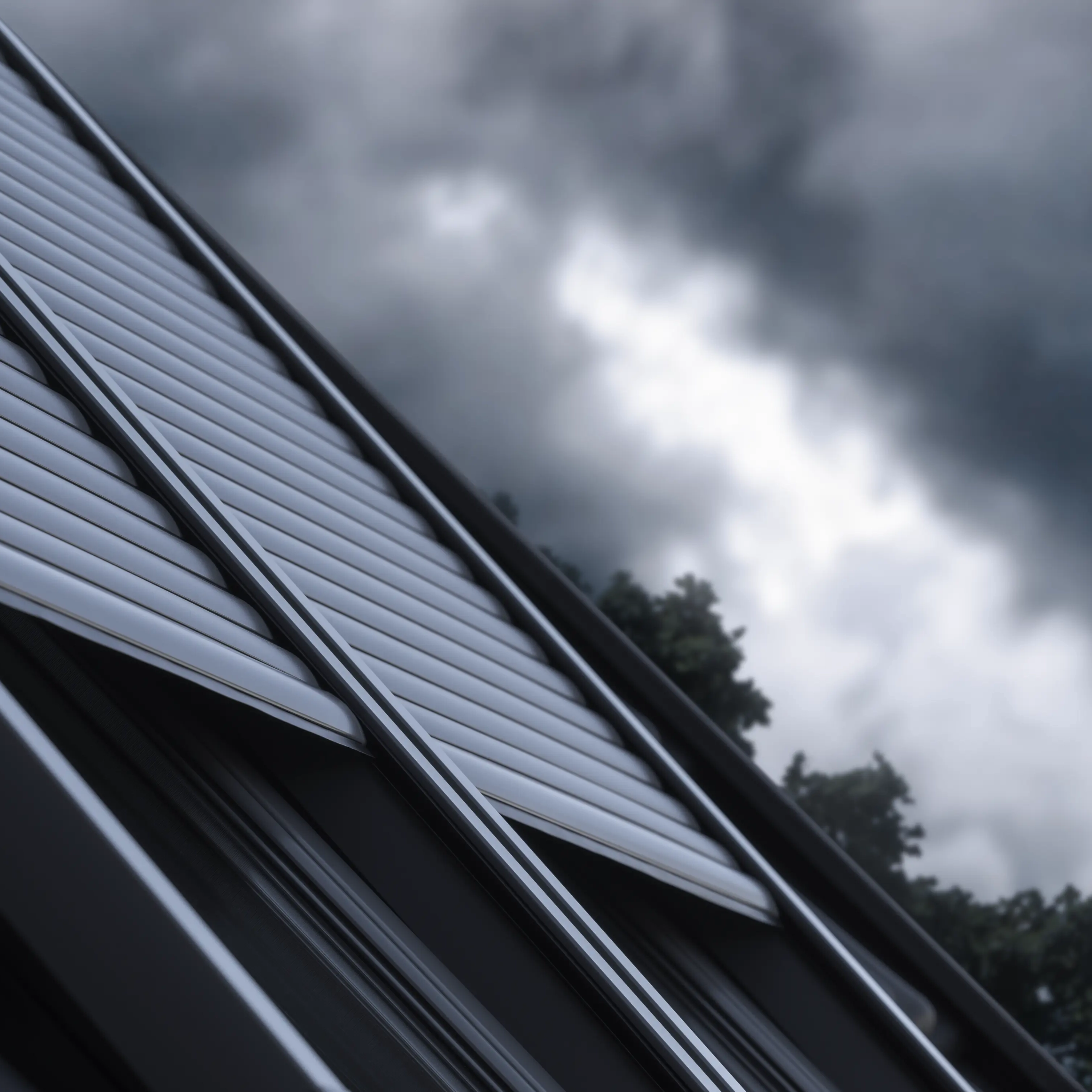 Modern metal roof with sleek panels under a stormy sky.