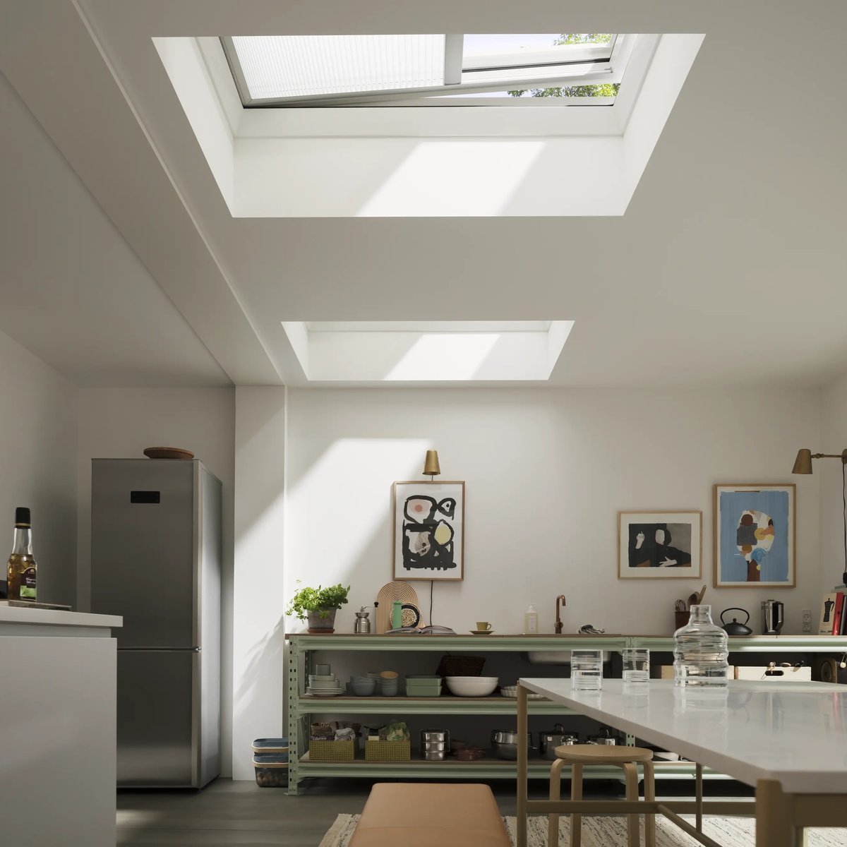 Modern kitchen with VELUX roof windows, natural light illuminating the space.