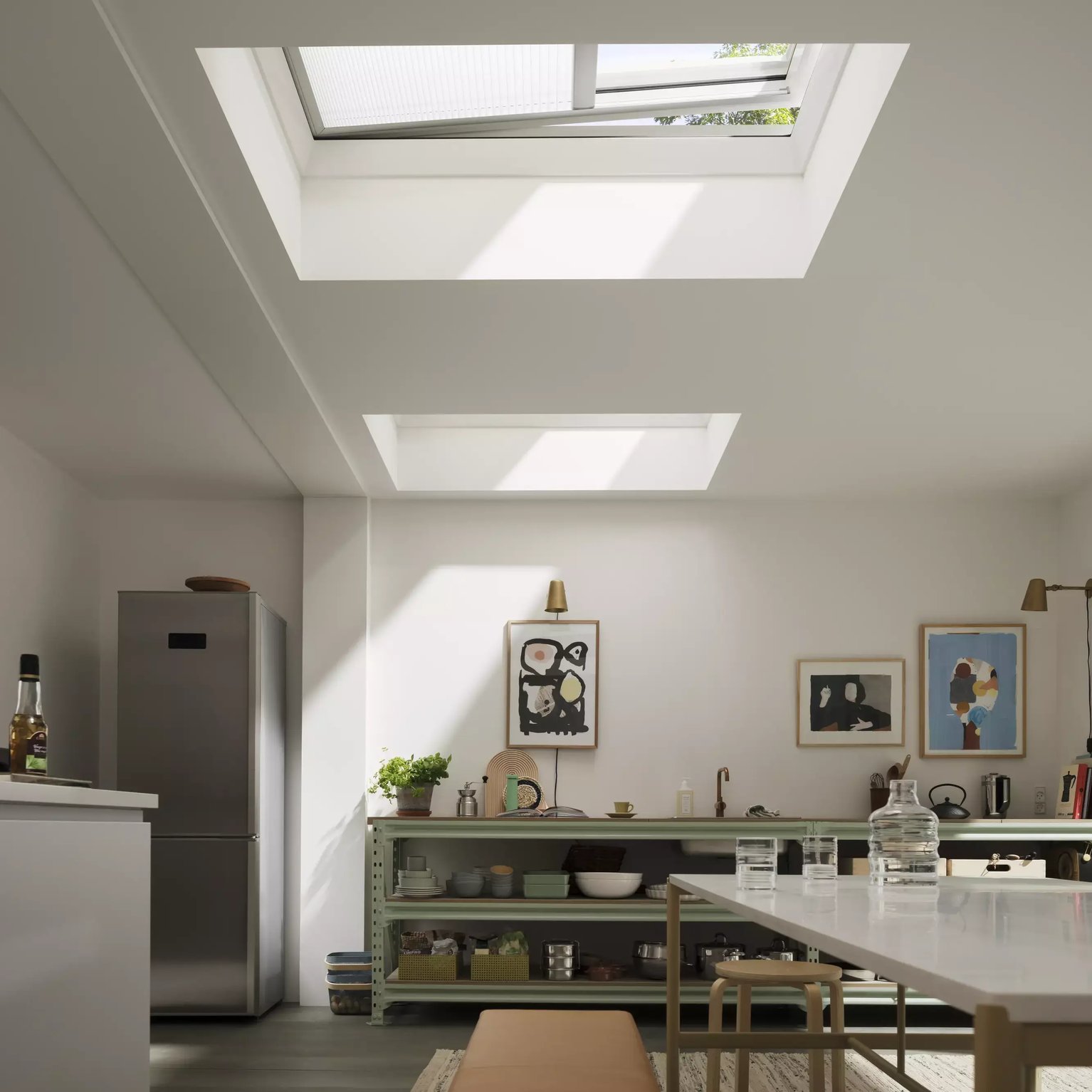 Modern kitchen with VELUX roof windows, natural light illuminating the space.