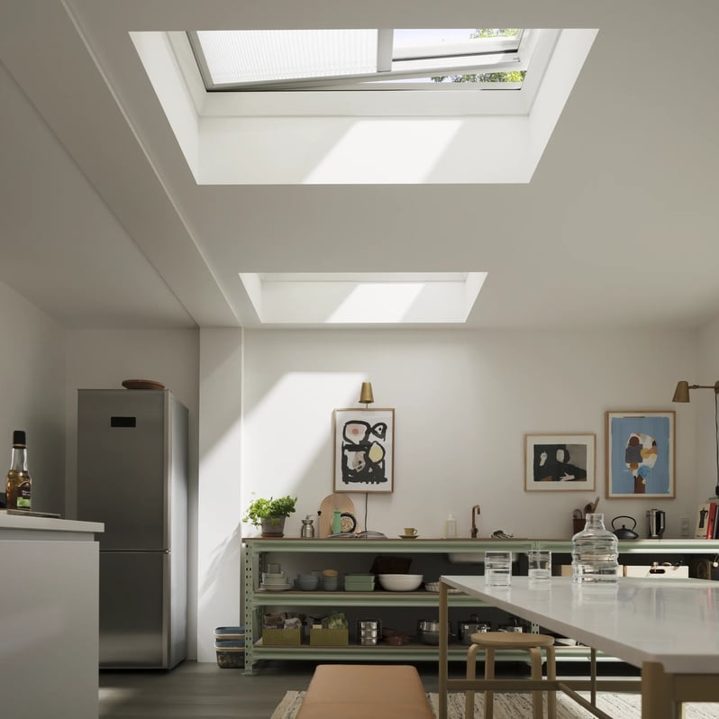 Modern kitchen with VELUX roof windows, natural light illuminating the space.
