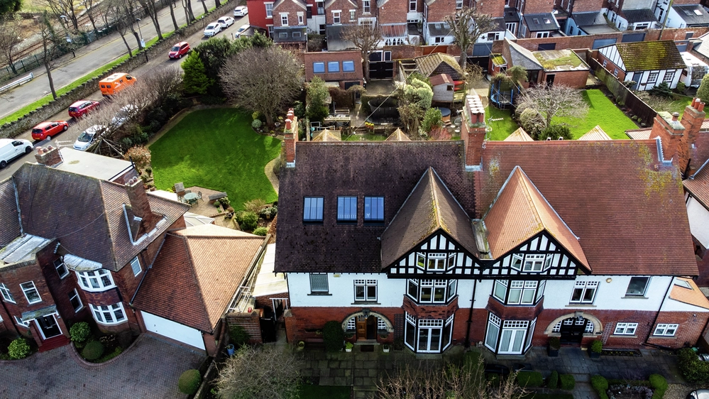 Period home seen from above with view of roof windows