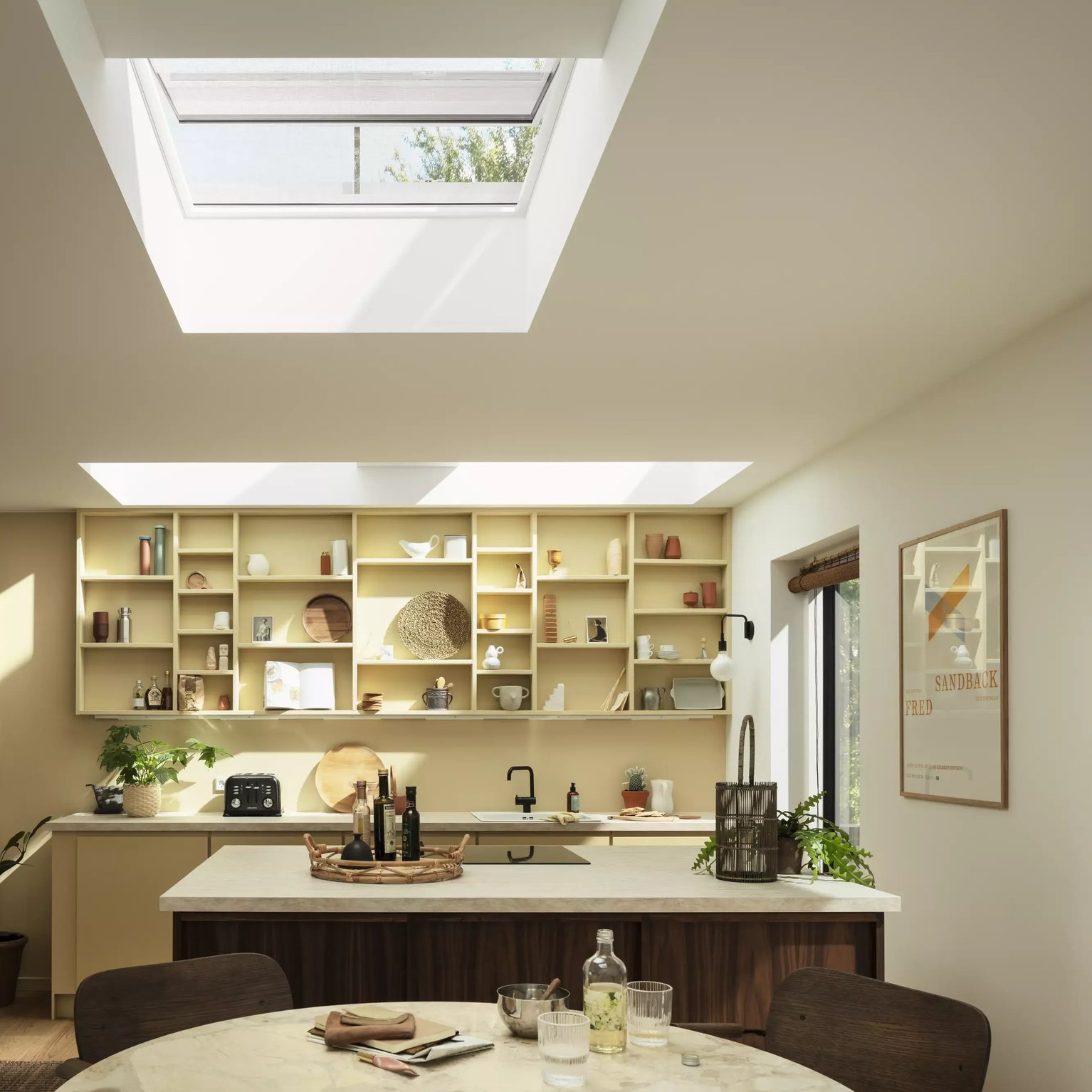 Modern kitchen with VELUX roof window, natural light illuminating the space.