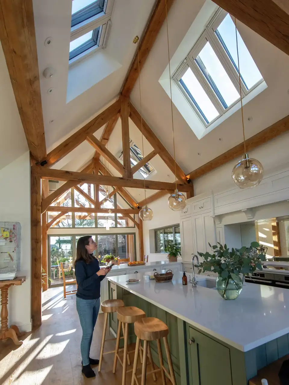 Kitchen and dining extension illuminated by roof windows