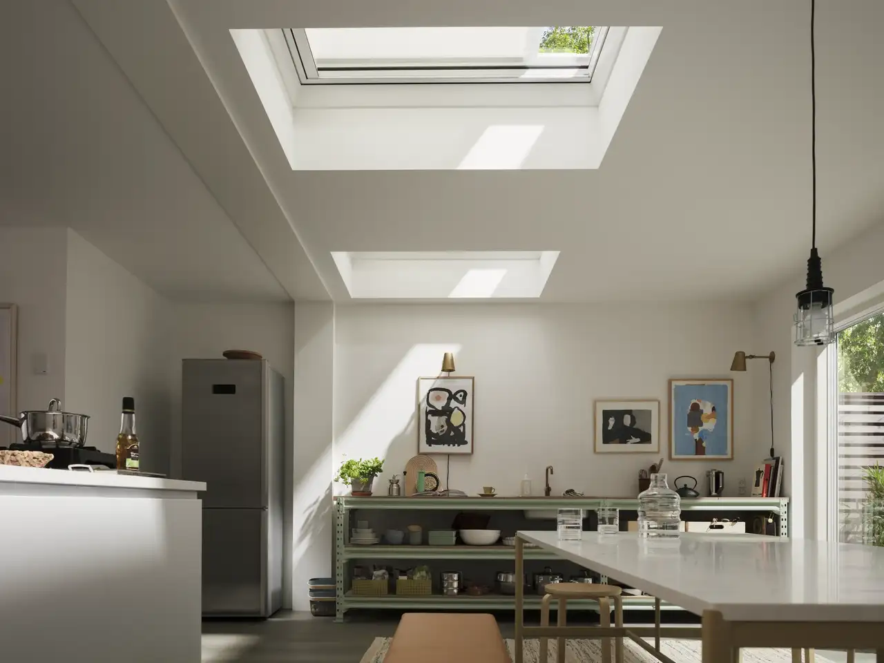 Kitchen extension in a modern house with VELUX flat rooflight and anti-heat blind reducing glare and heat build-up.
