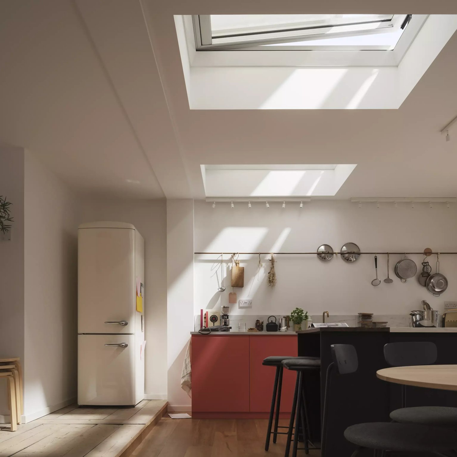 Modern kitchen with VELUX roof window, natural light illuminating the space.