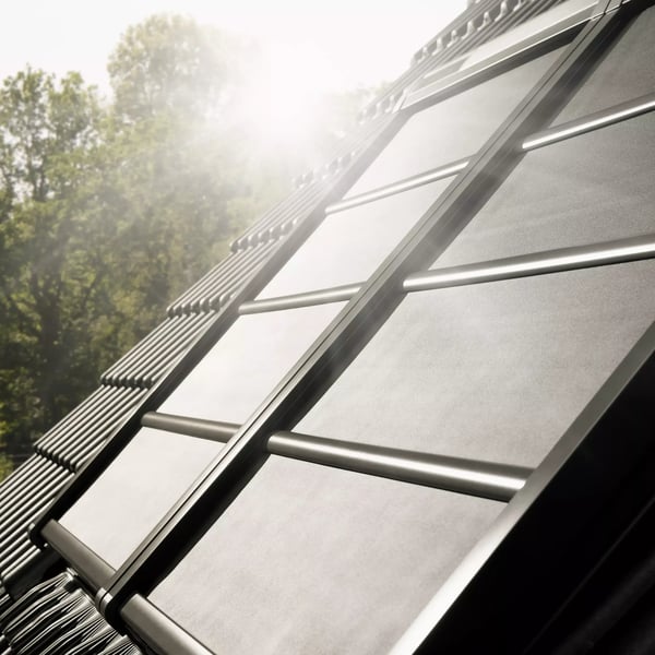 Solar roof tiles integrated with traditional roofing, harnessing solar energy.