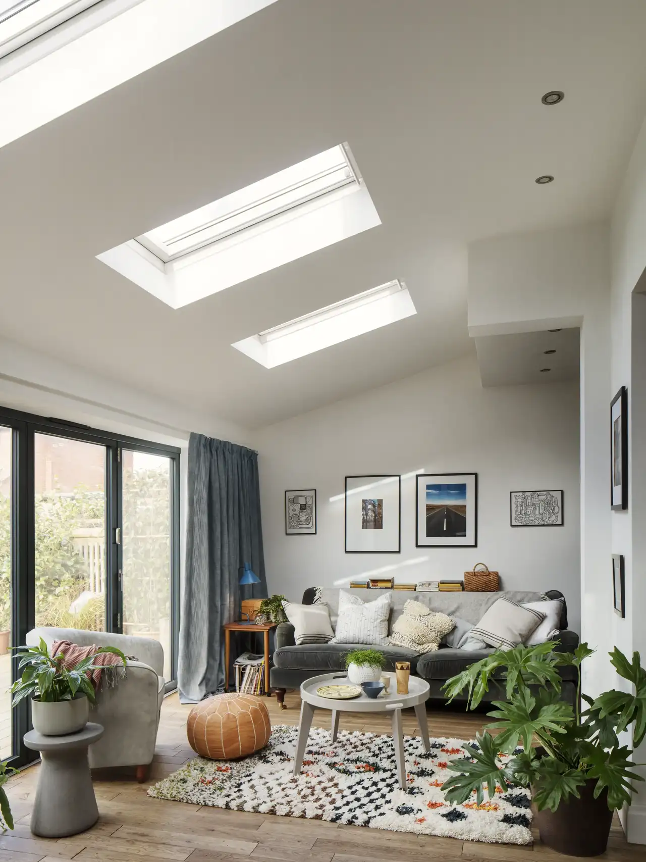 Living room with VELUX roof window, family seating area, and natural light.
