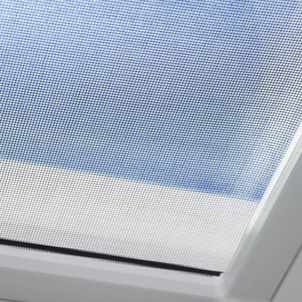 VELUX roof window with mesh screen, natural light filtering through.