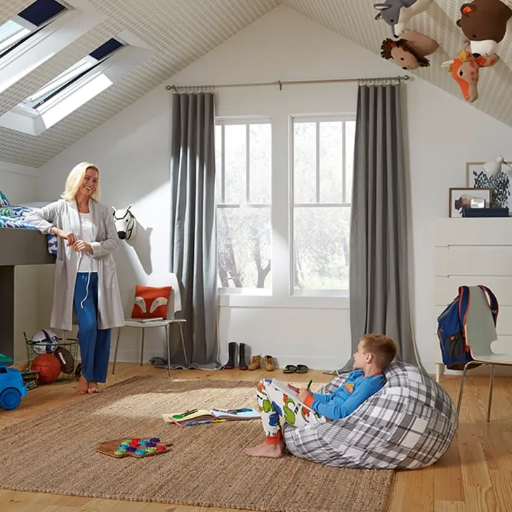 Kids room with loft bed, bean bag, and roof windows.