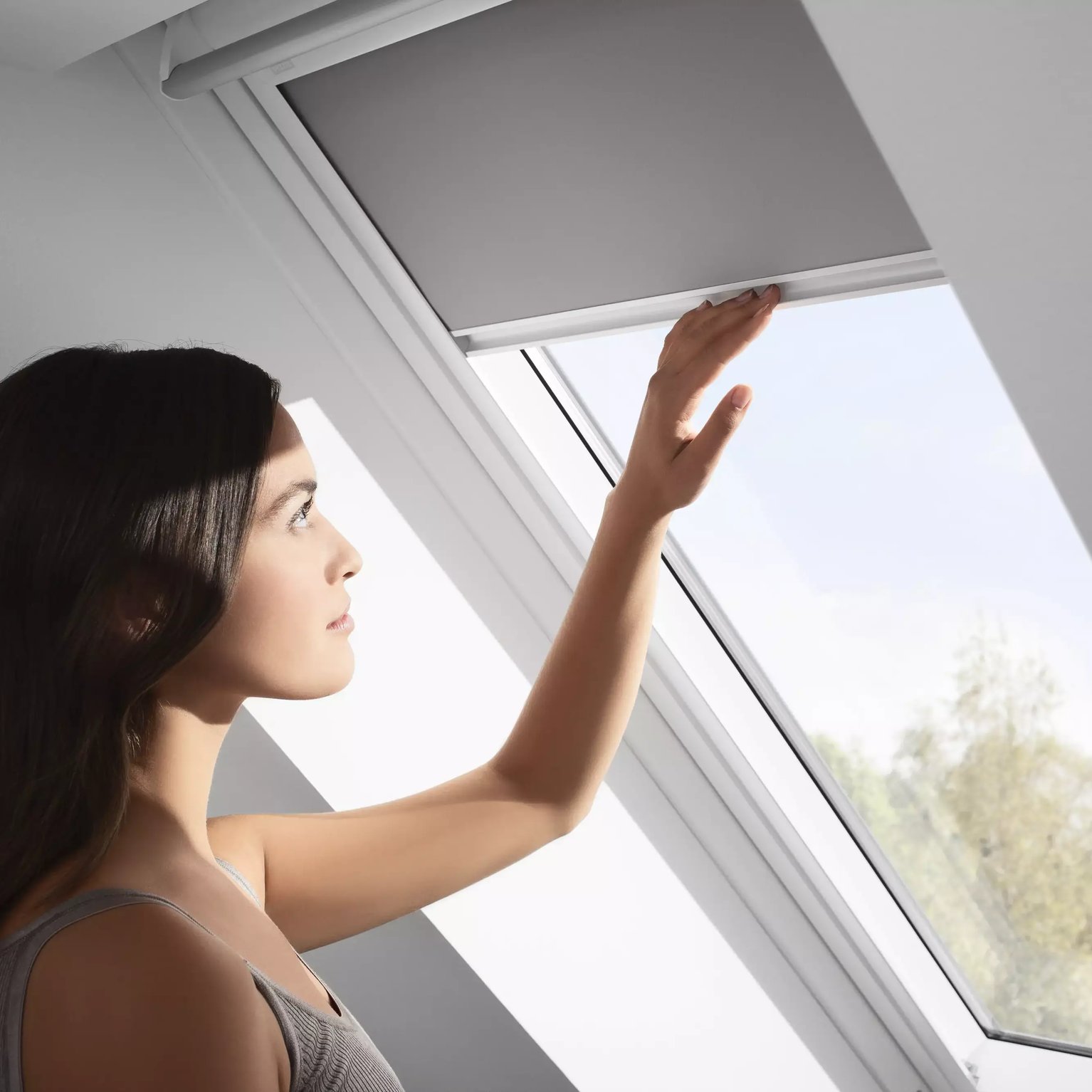 Attic room with VELUX roof window, sloped ceiling, natural light.