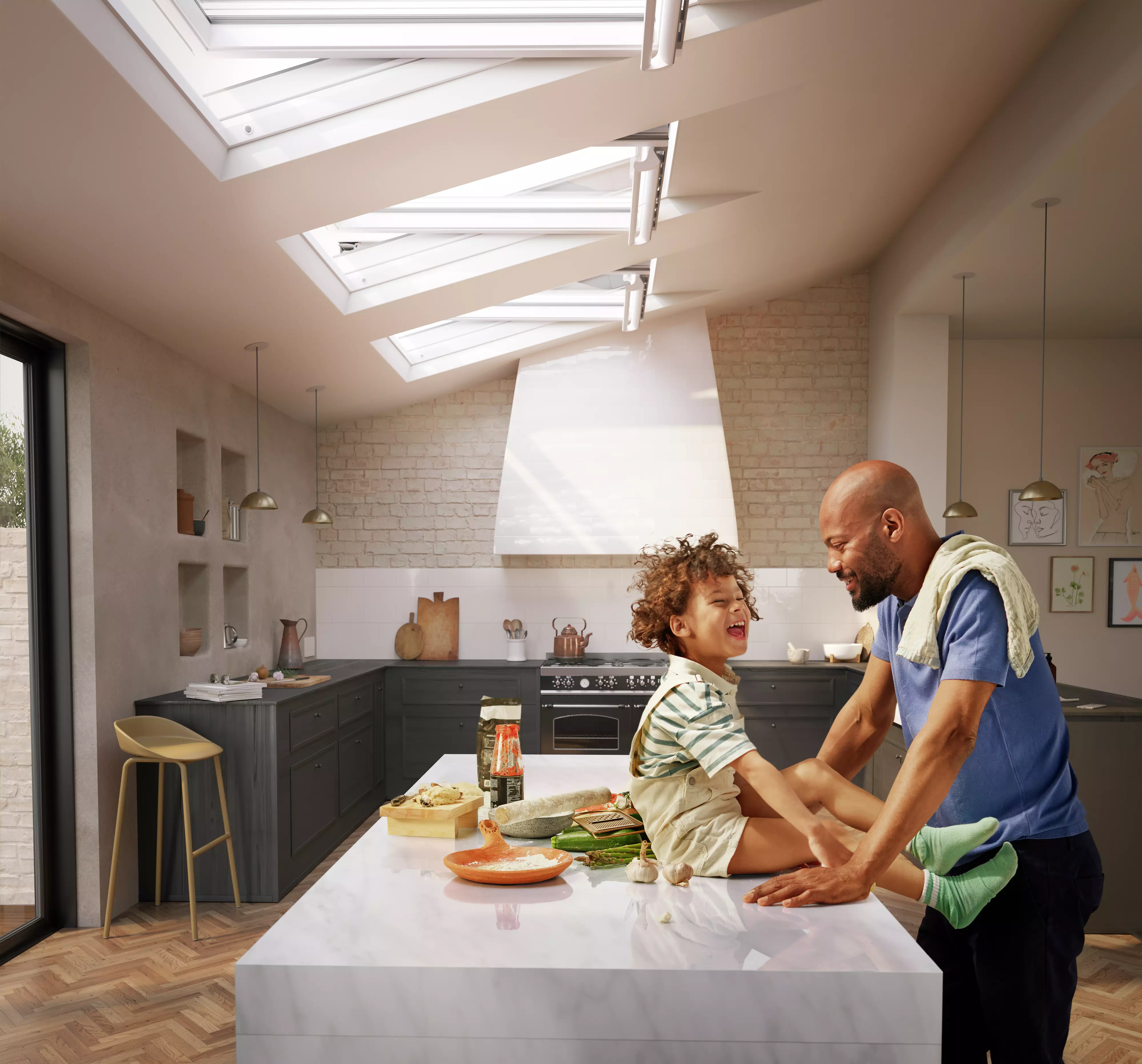 Father and son in kitchen with VELUX windows