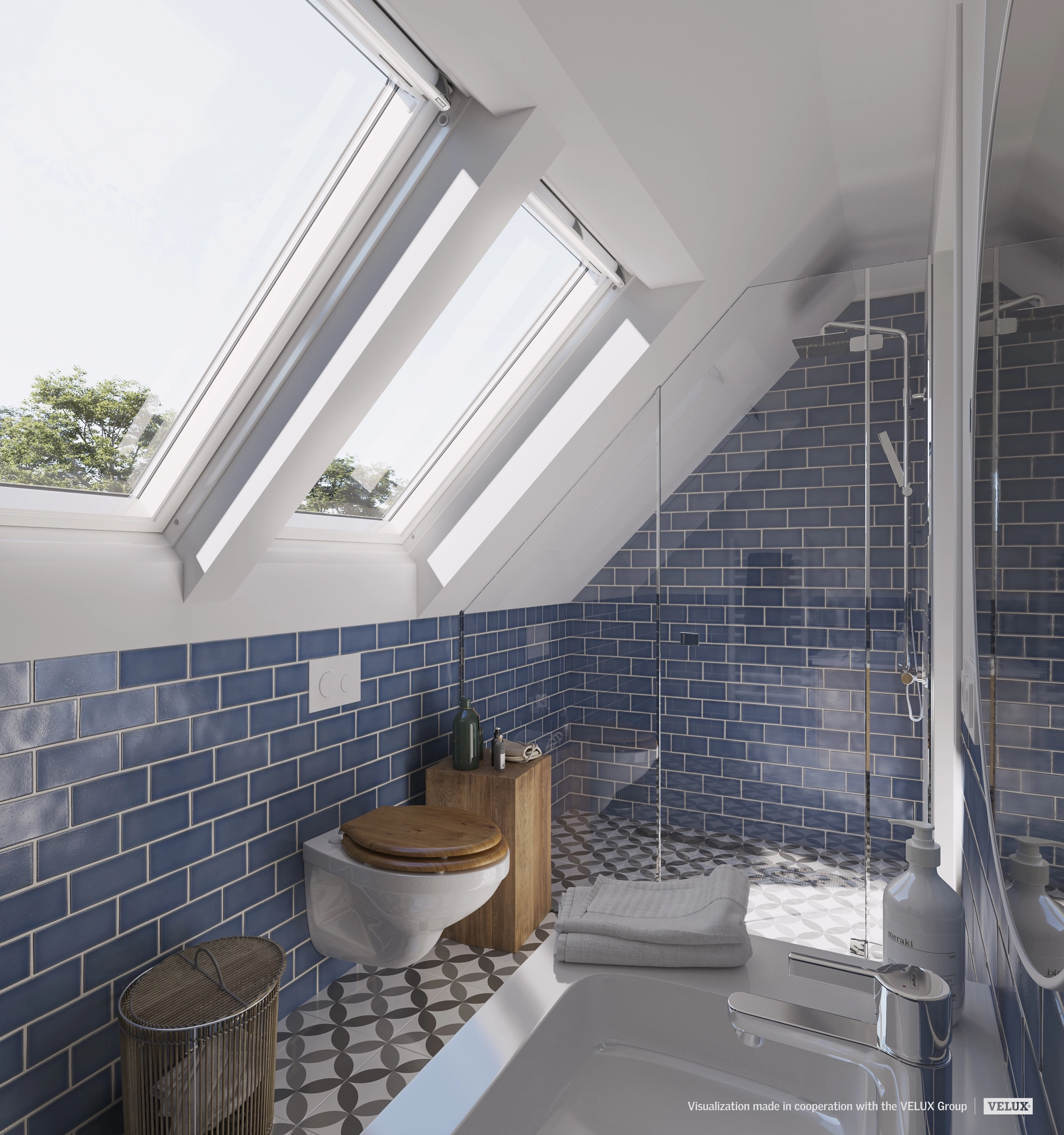 Attic bathroom with sloped ceiling and VELUX roof windows, blue tiles.