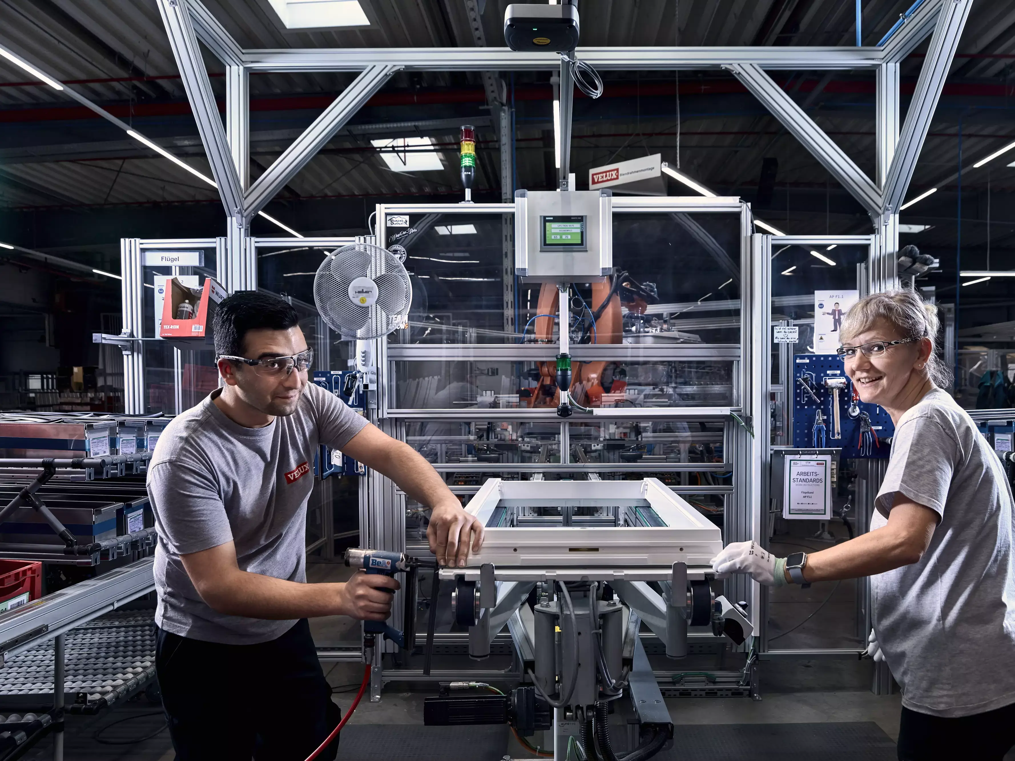 Man and woman working in VELUX factory
