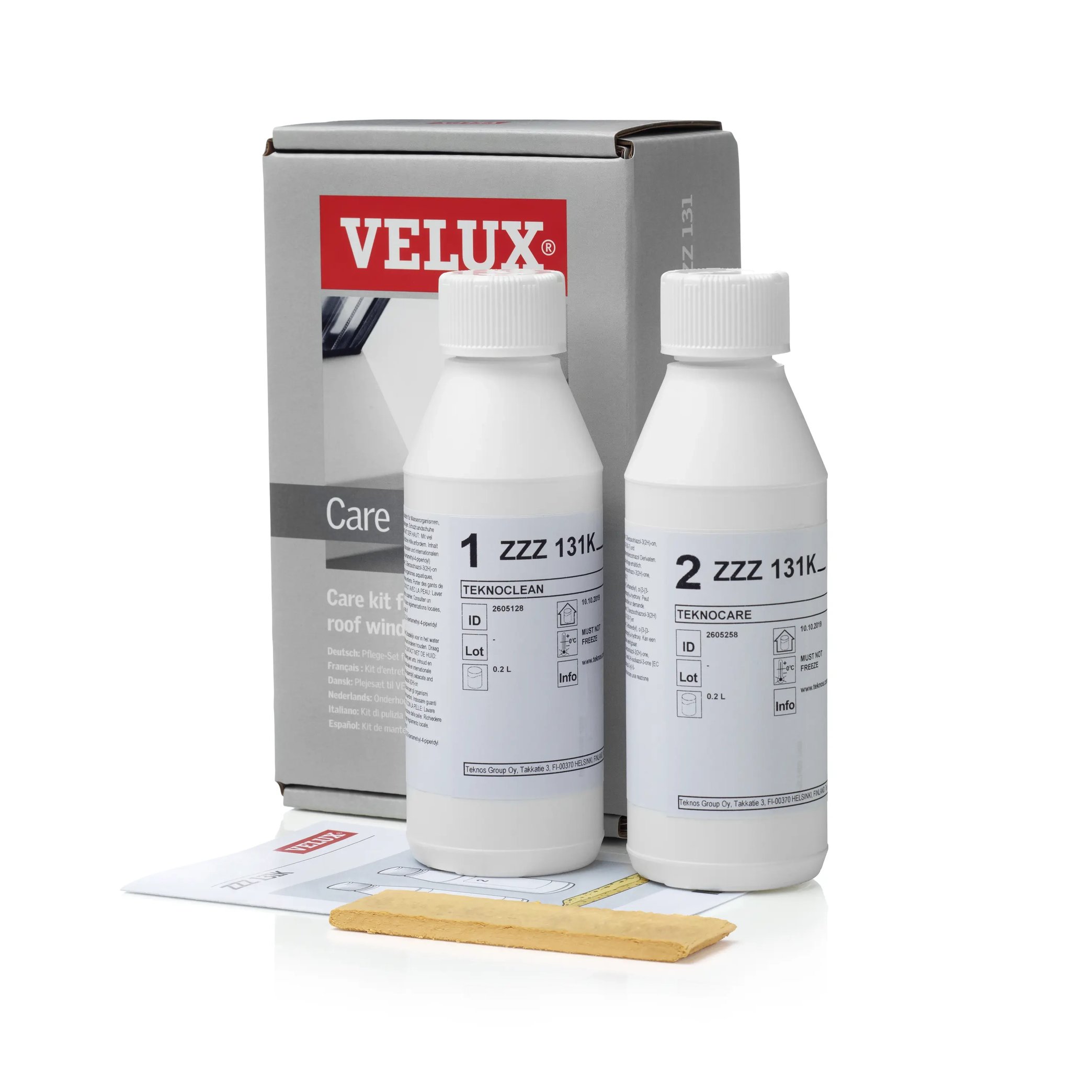 VELUX roof window care kit with cleaning solutions and sponge.