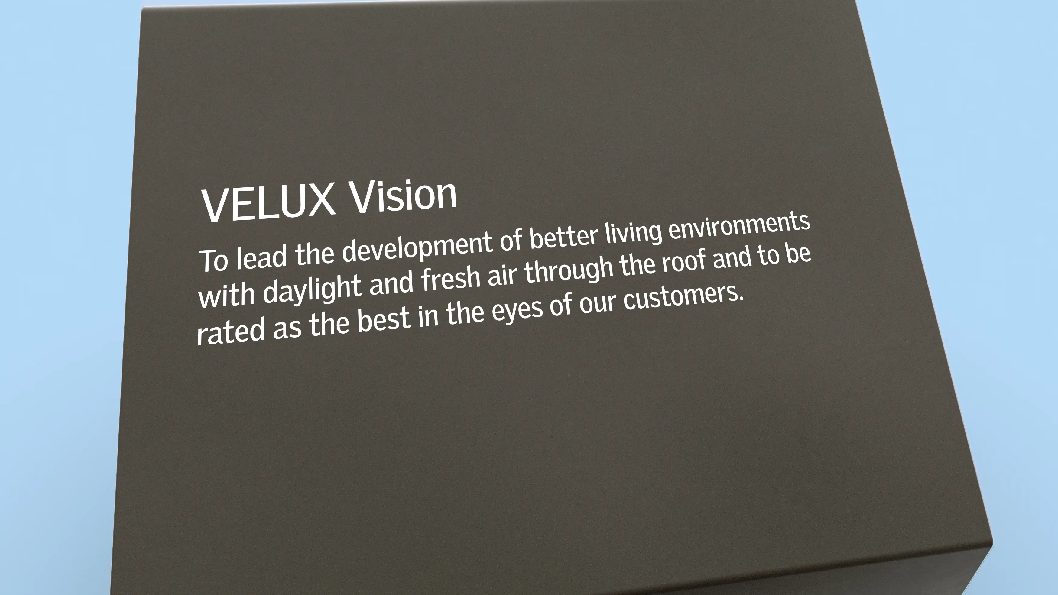VELUX Vision statement on a sleek surface, emphasizing daylight and fresh air.