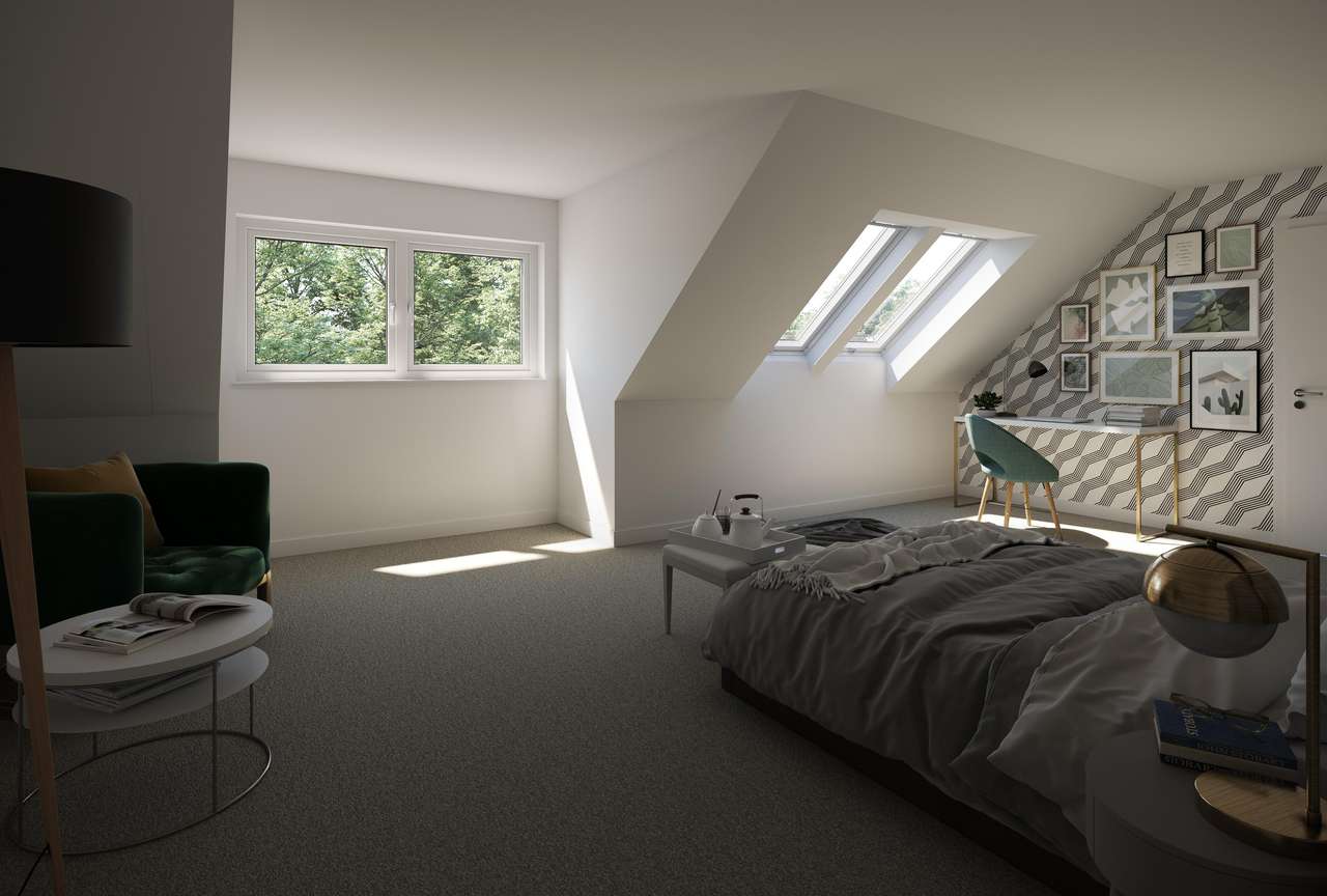Schickes Schlafzimmer im Dachboden mit VELUX Dachflächenfenster und einer Aussicht auf Grünanlagen.