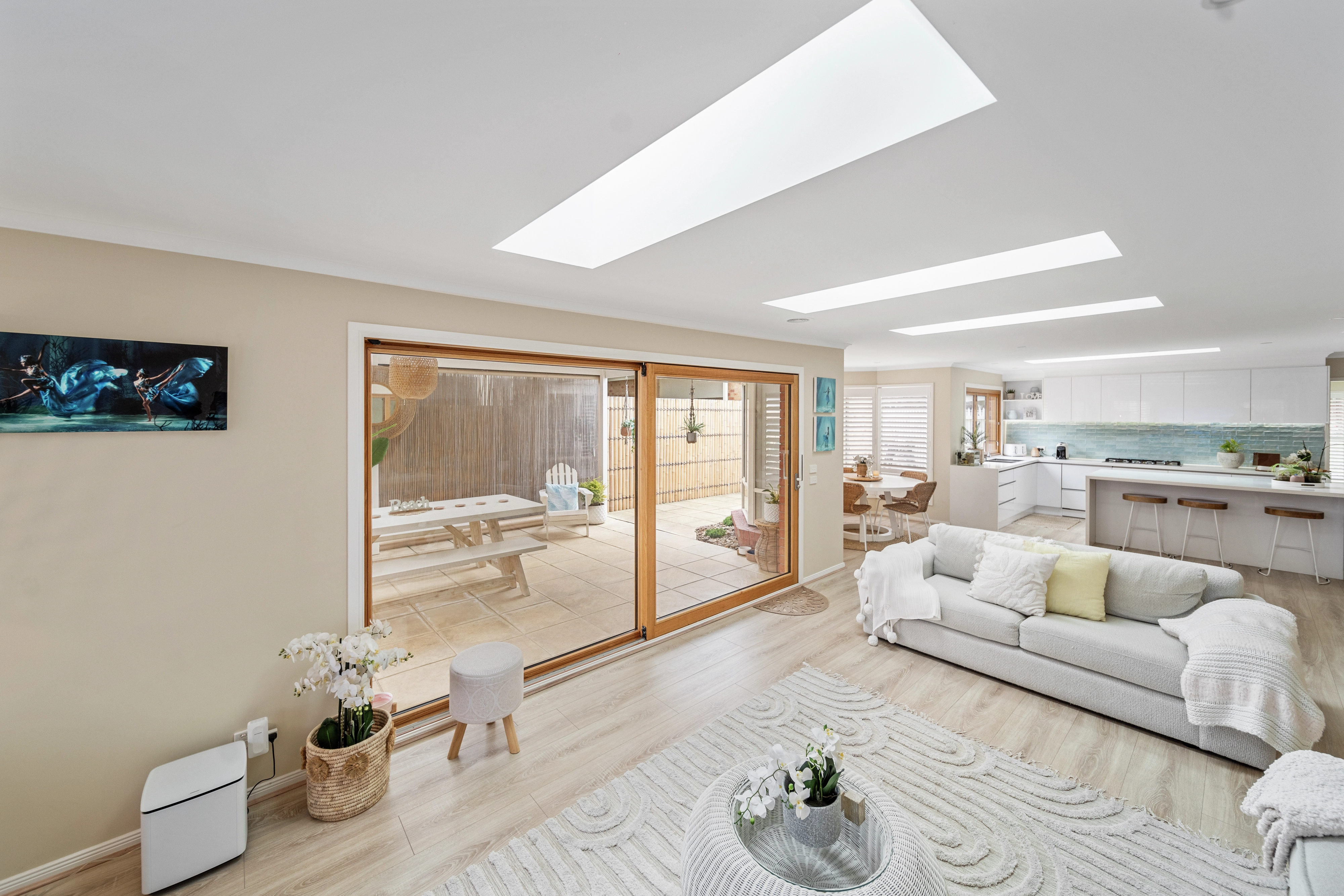 Bright living area with skylights and open-plan design.