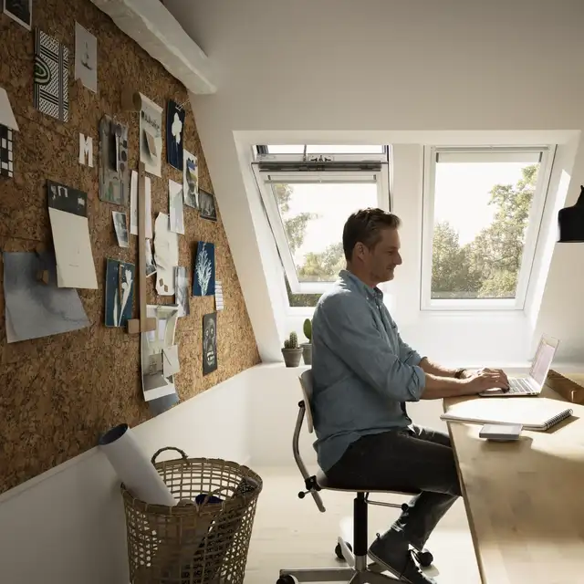 Man sitting by a computer