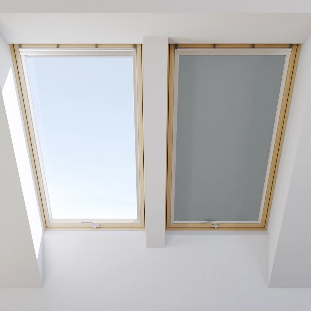 Two VELUX roof windows, one open, one closed with blind.