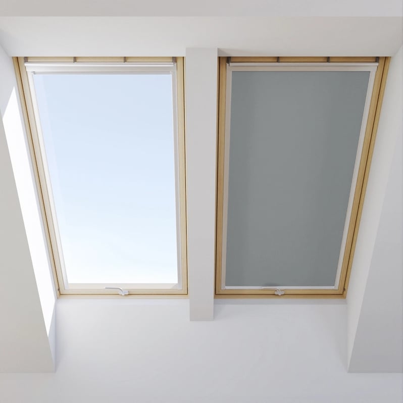 Two VELUX roof windows, one open, one closed with blind.