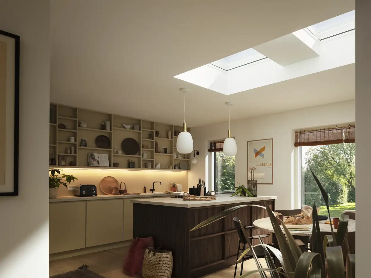 Modern kitchen with VELUX roof windows, natural light illuminating the space. 