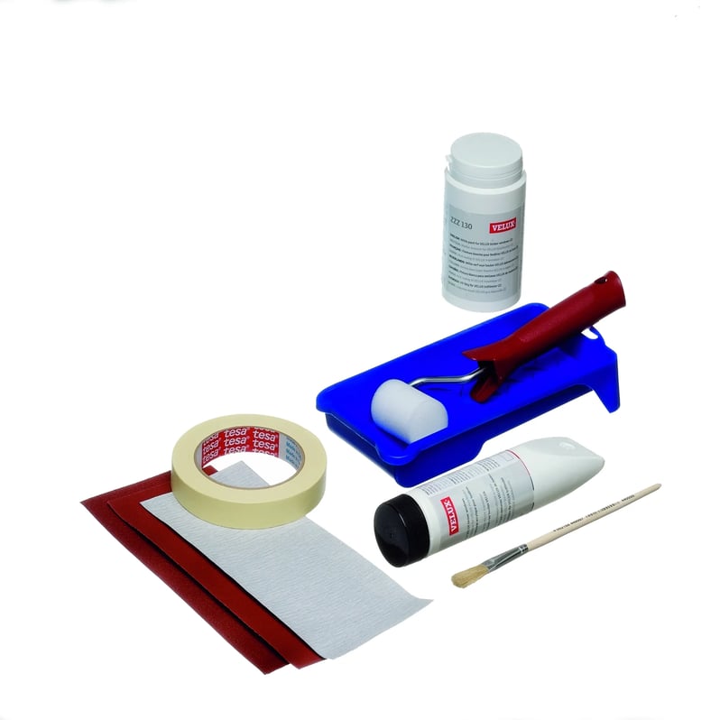 VELUX maintenance kit with roller, brush, tape, and cleaning solutions.