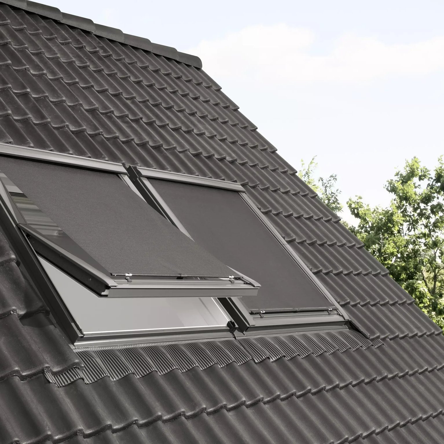 Modern roof with black tiles and open VELUX roof window.