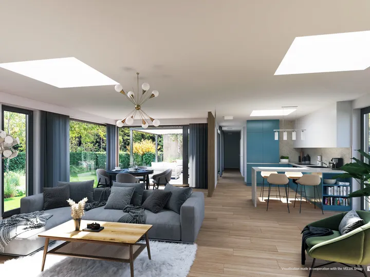 Open-plan living area with VELUX flat roof windows and modern decor.
