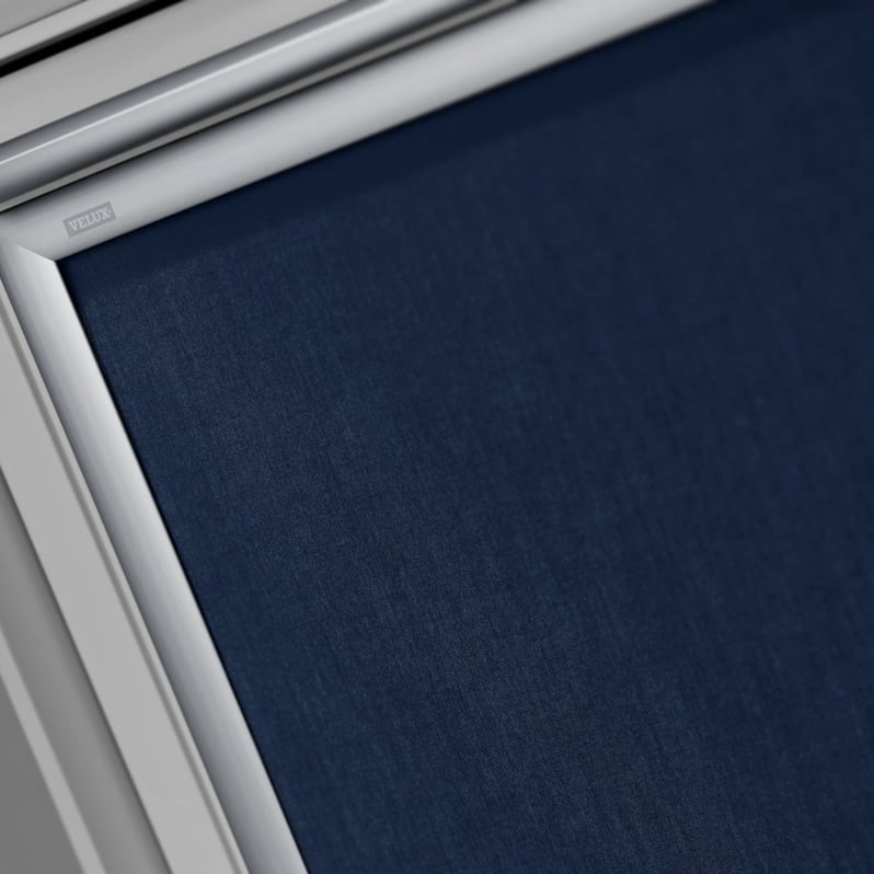 Close-up of VELUX roof window with dark blue blind.