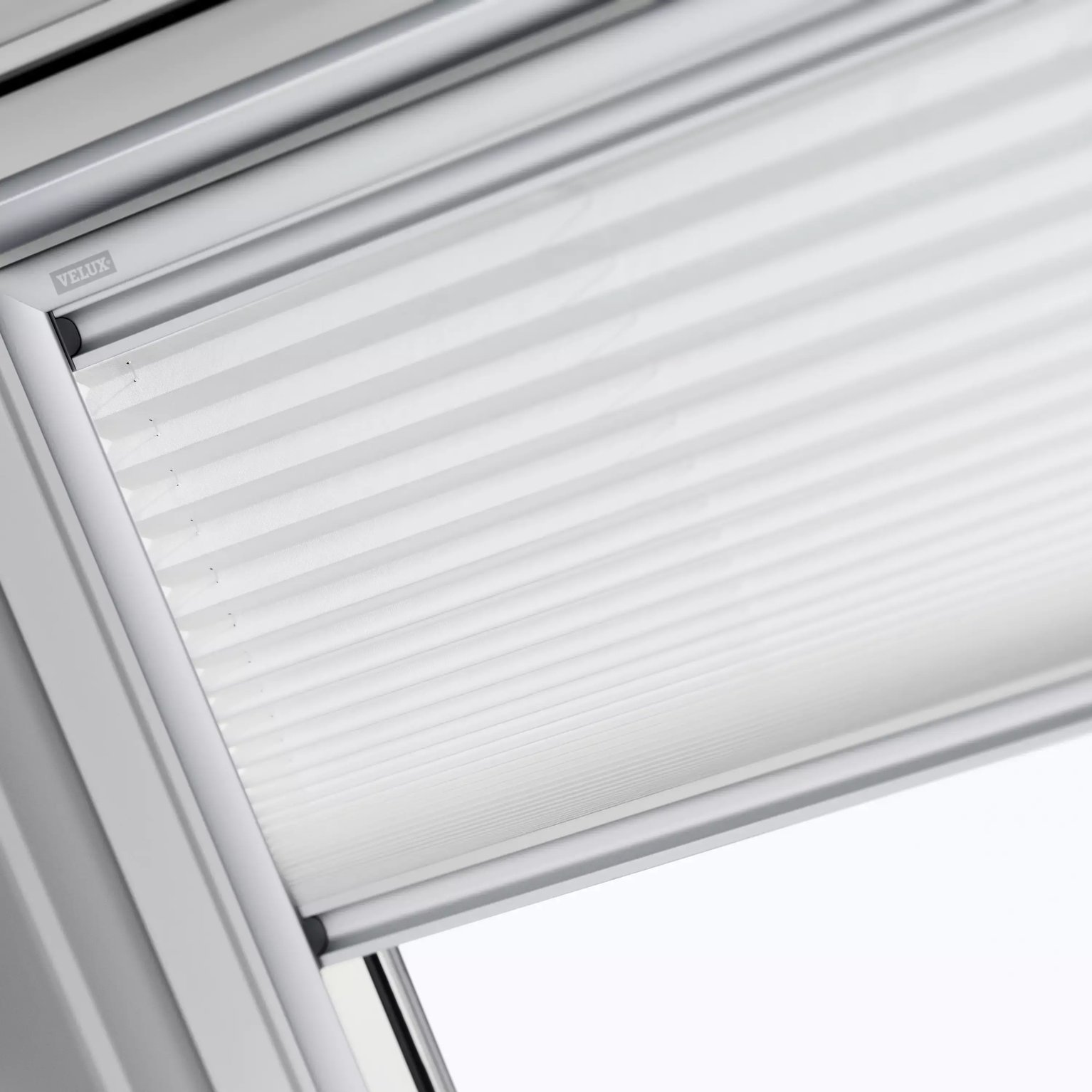 VELUX roof window with integrated blind, partially open.