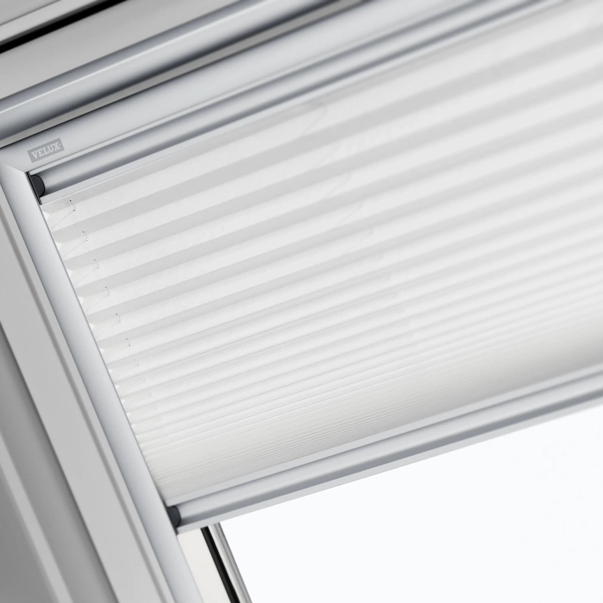 VELUX roof window with integrated blind, partially open.