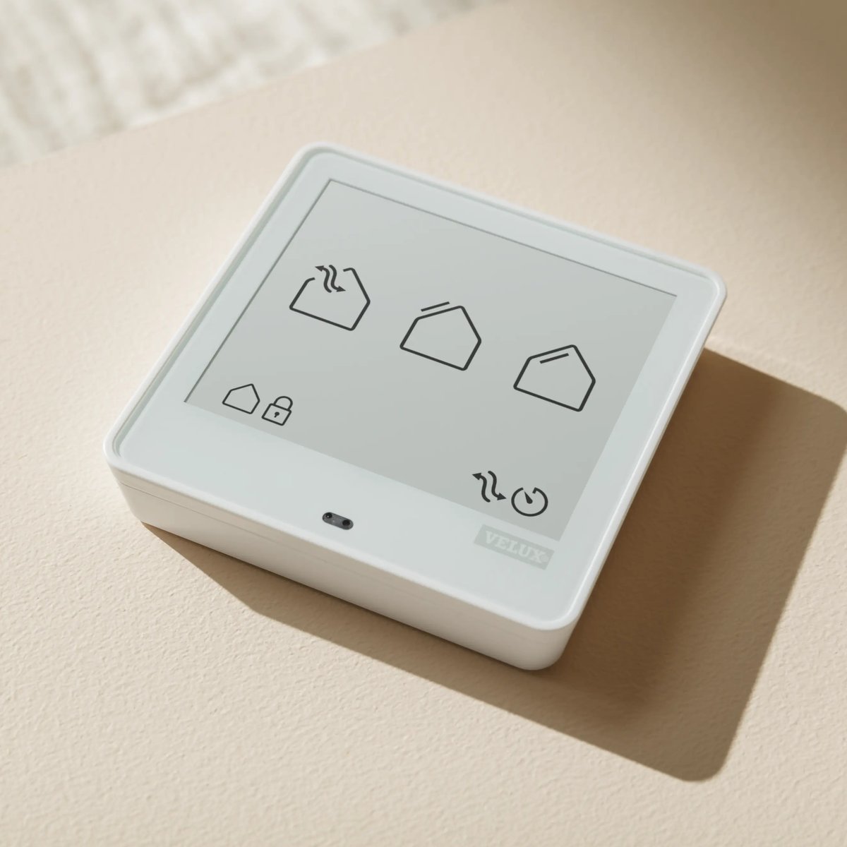 VELUX smart control panel with icons for window and climate management.