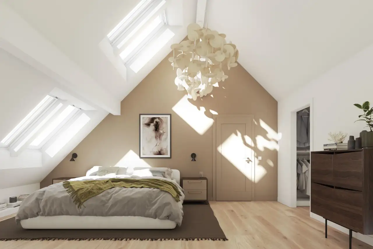 Camera da letto in mansarda con ampie finestre per tetti