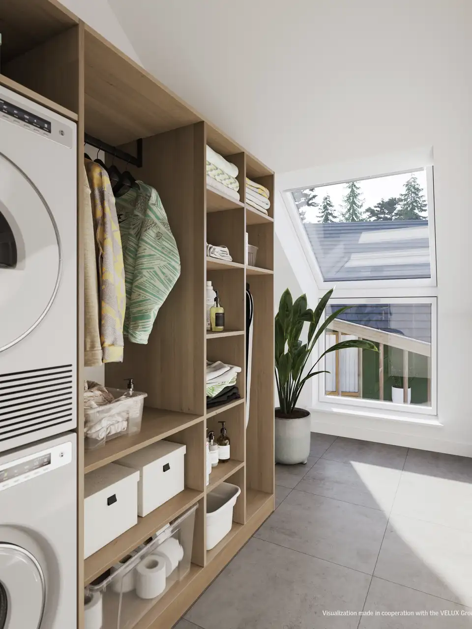  buanderie avec lave-linge et sèche-linge superposés en colonne, et meuble de rangement