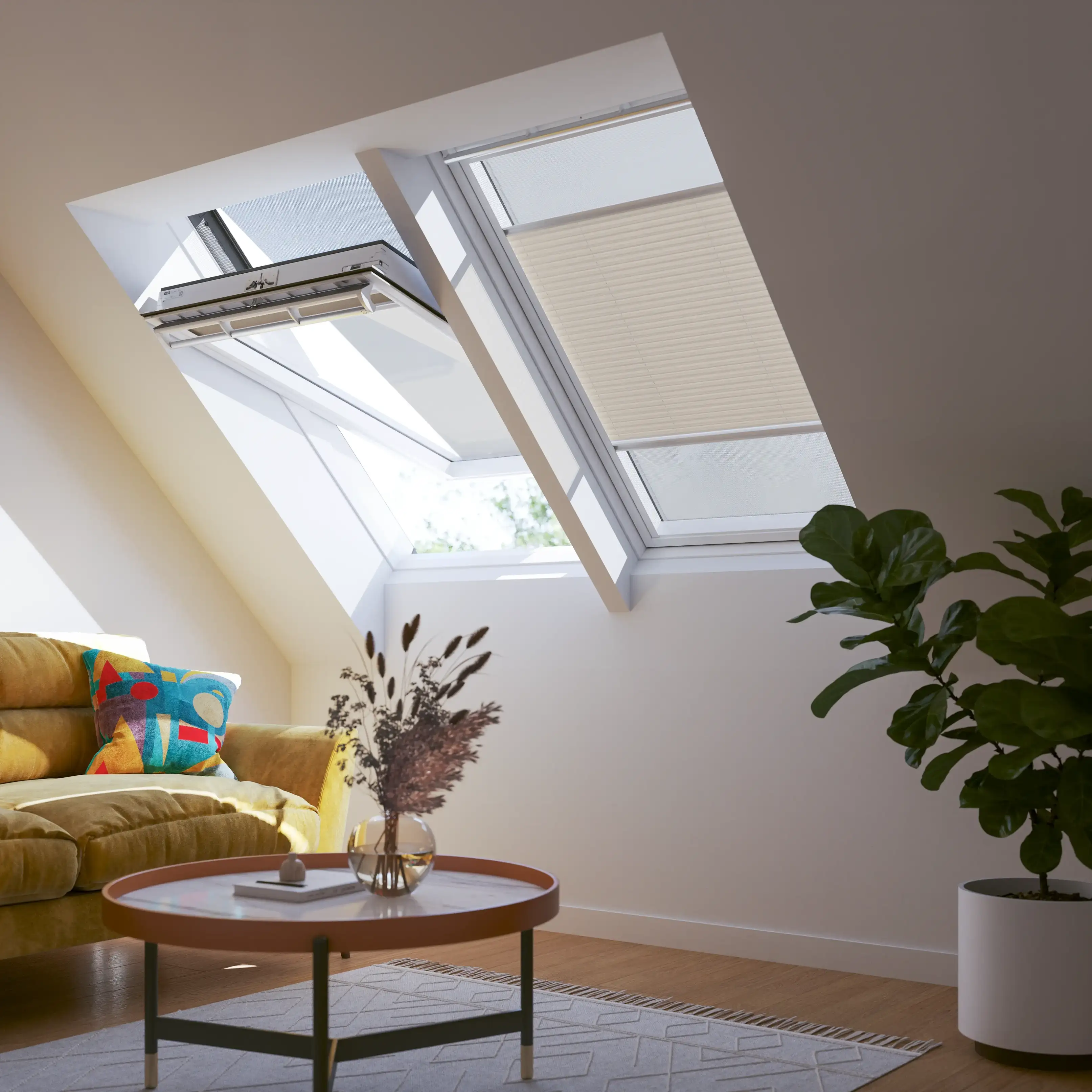 Attic living room with sloped ceiling and VELUX roof windows, cozy decor.