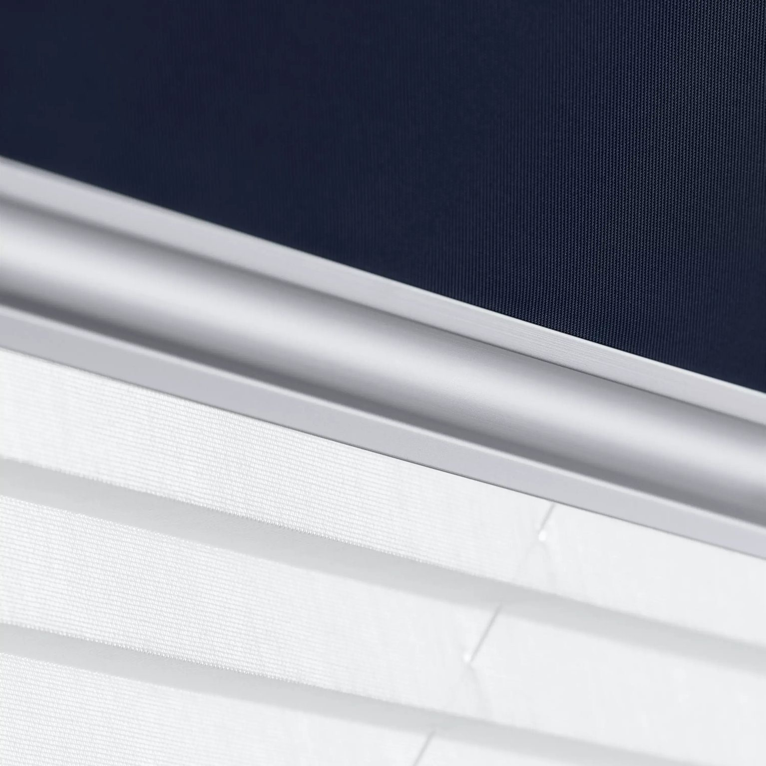 Close-up of modern window blind with sleek design and fabric texture.