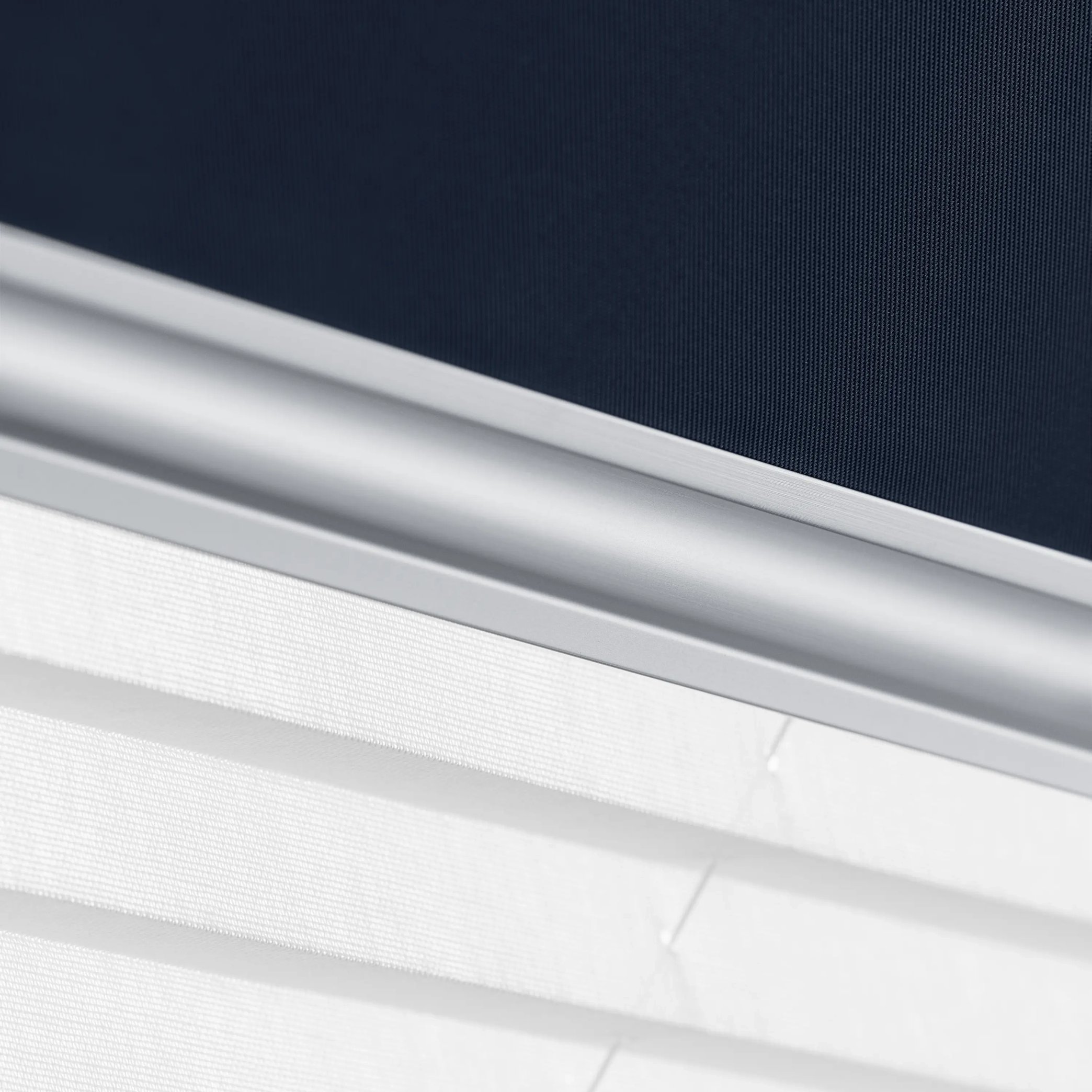 Close-up of modern window blind with sleek design and fabric texture.