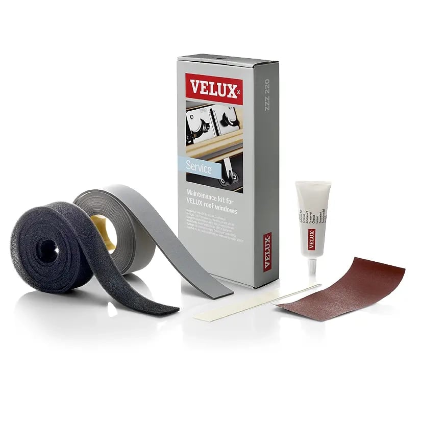 VELUX roof window maintenance kit with adhesive strips and lubricant.