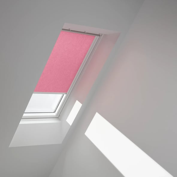 VELUX roof window with pink blind in a sloped ceiling attic room.