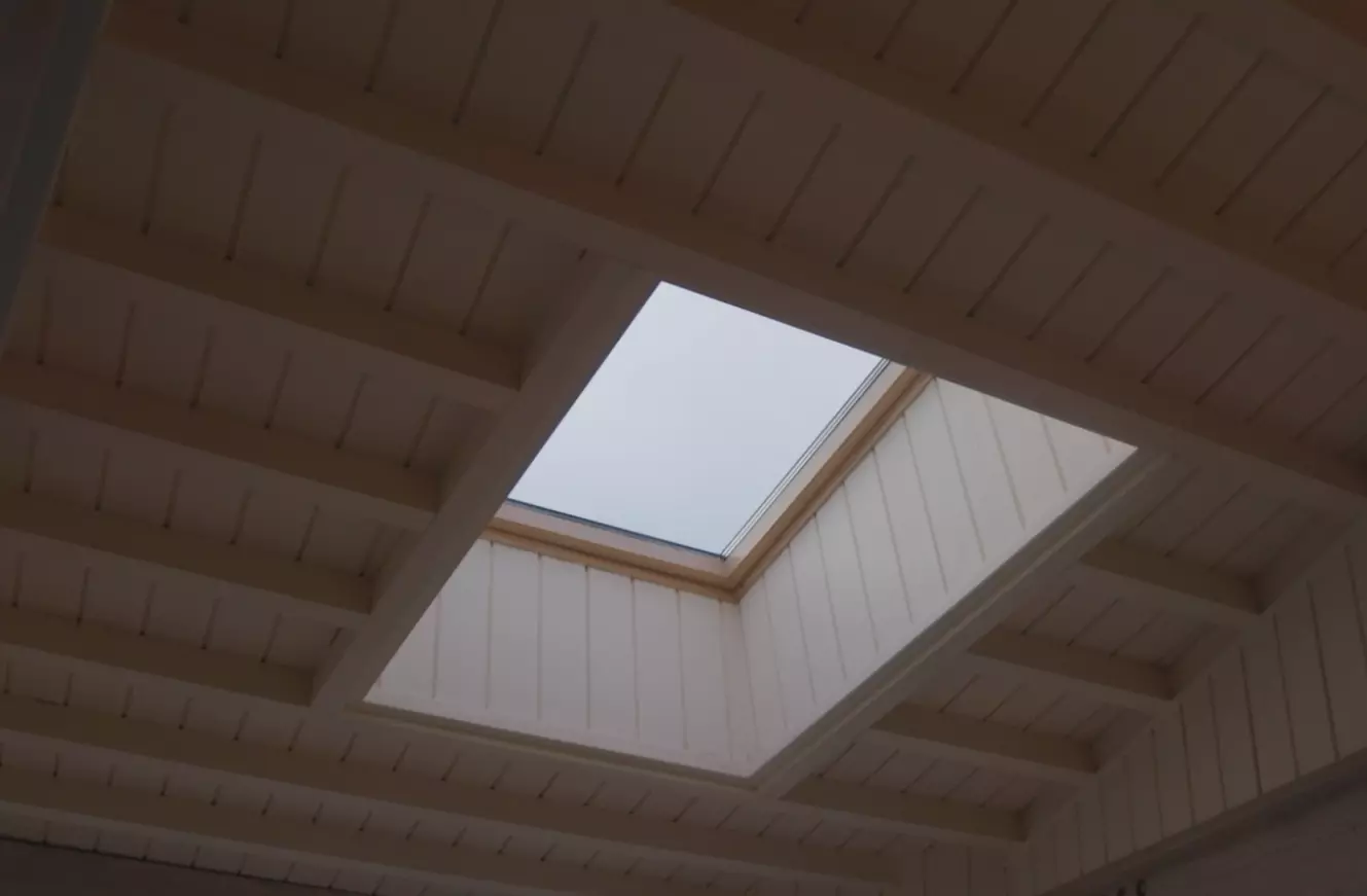 Velux roof window in wooden ceiling