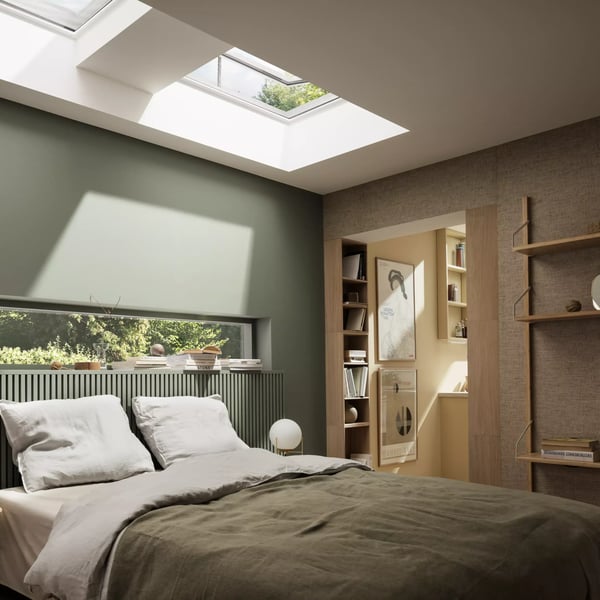 Bedroom with VELUX roof window, natural light and earthy decor.