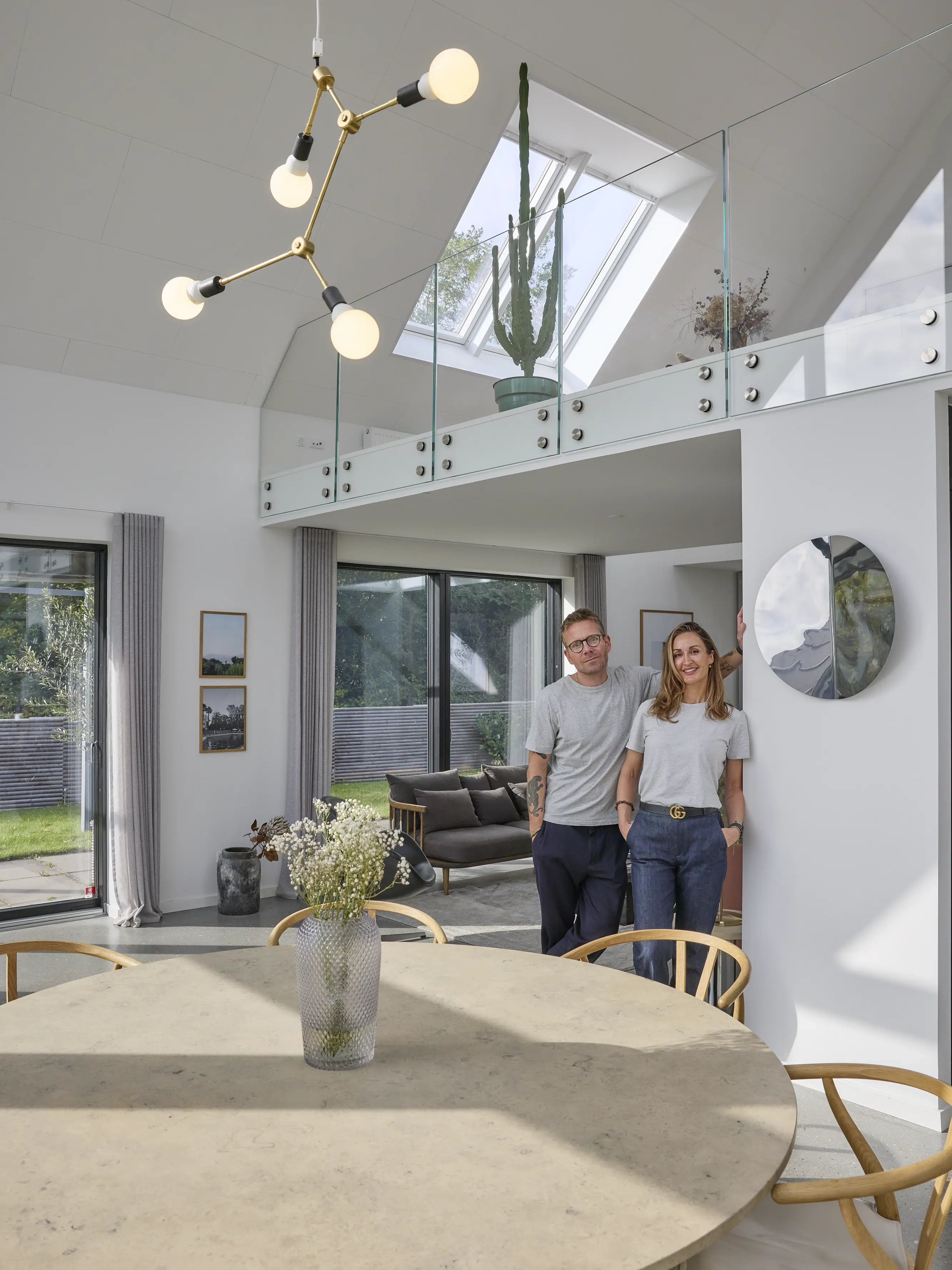 Living room with VELUX roof window, modern decor, and garden view.