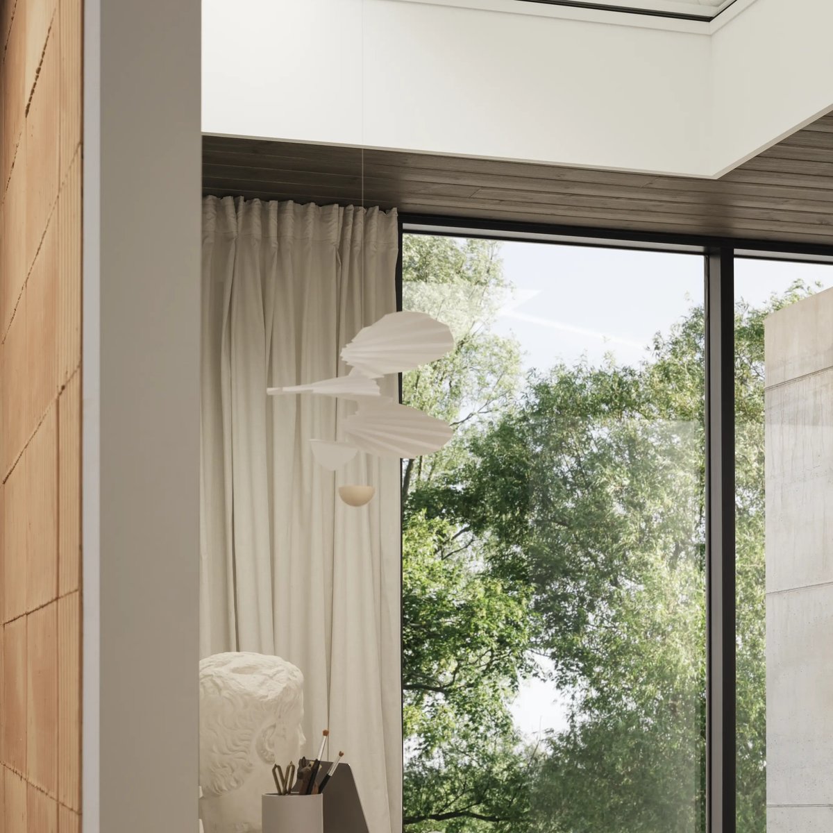Home office with VELUX roof window, modern decor, and natural light.
