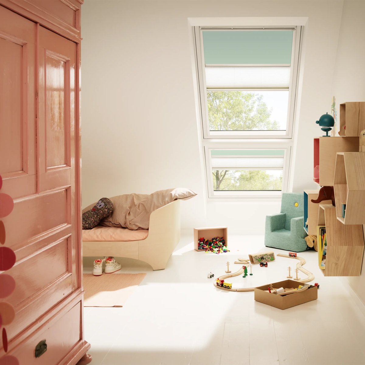 Attic kids room with sloped ceiling, VELUX roof window, playful decor.
