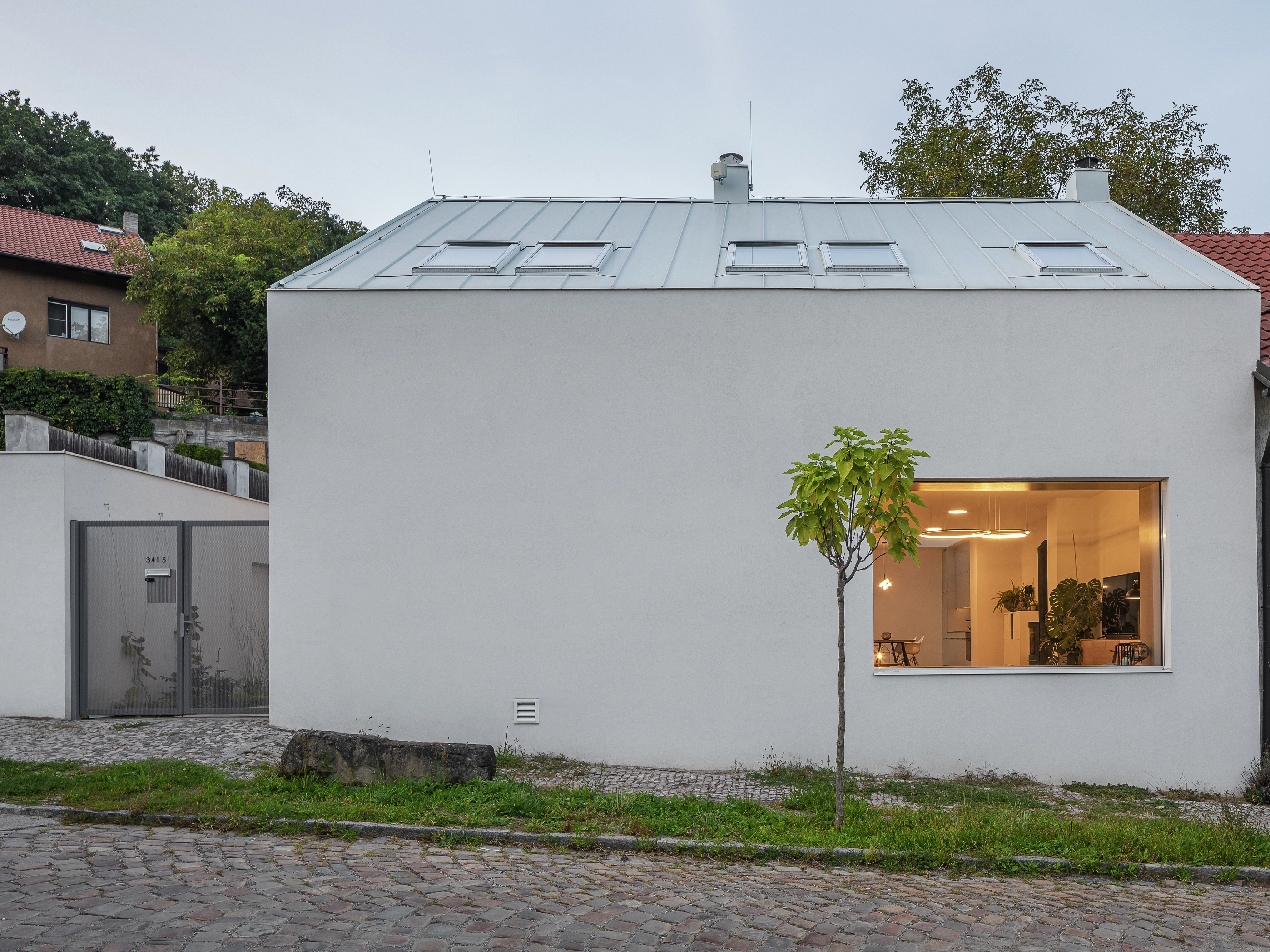 Contemporary house with metal roof and VELUX roof windows.