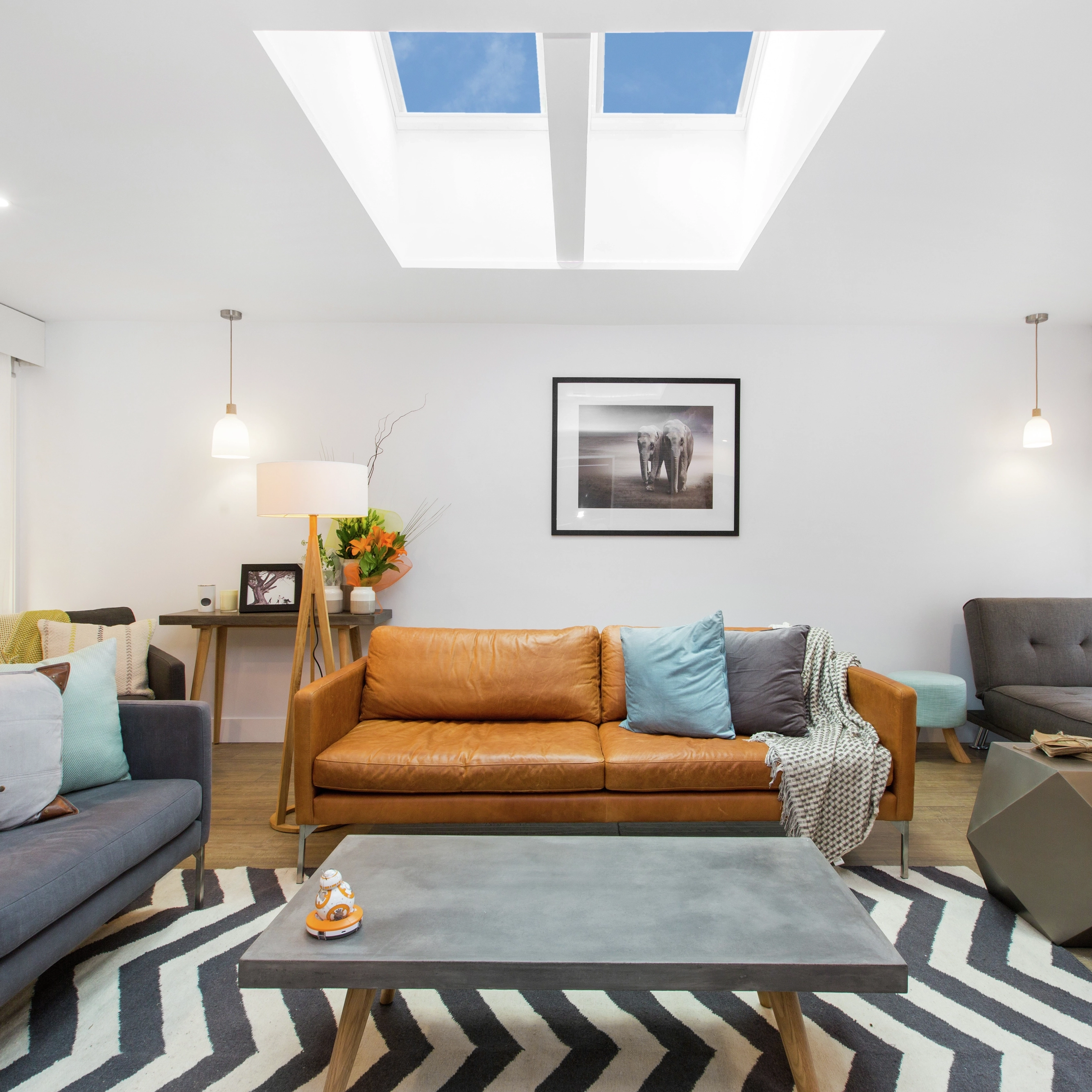 Living room with VELUX roof window and modern decor.