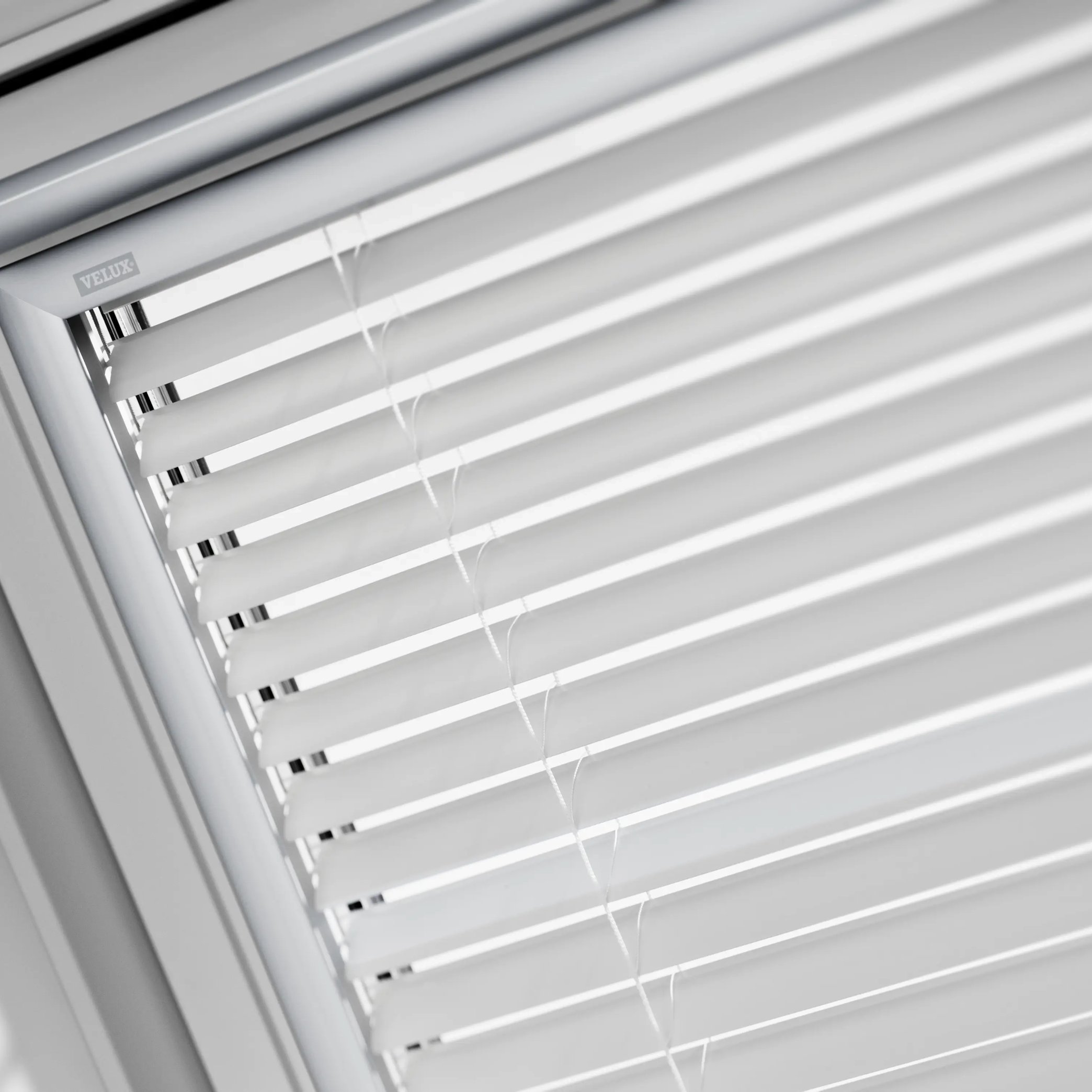 VELUX roof window with white blinds partially open.