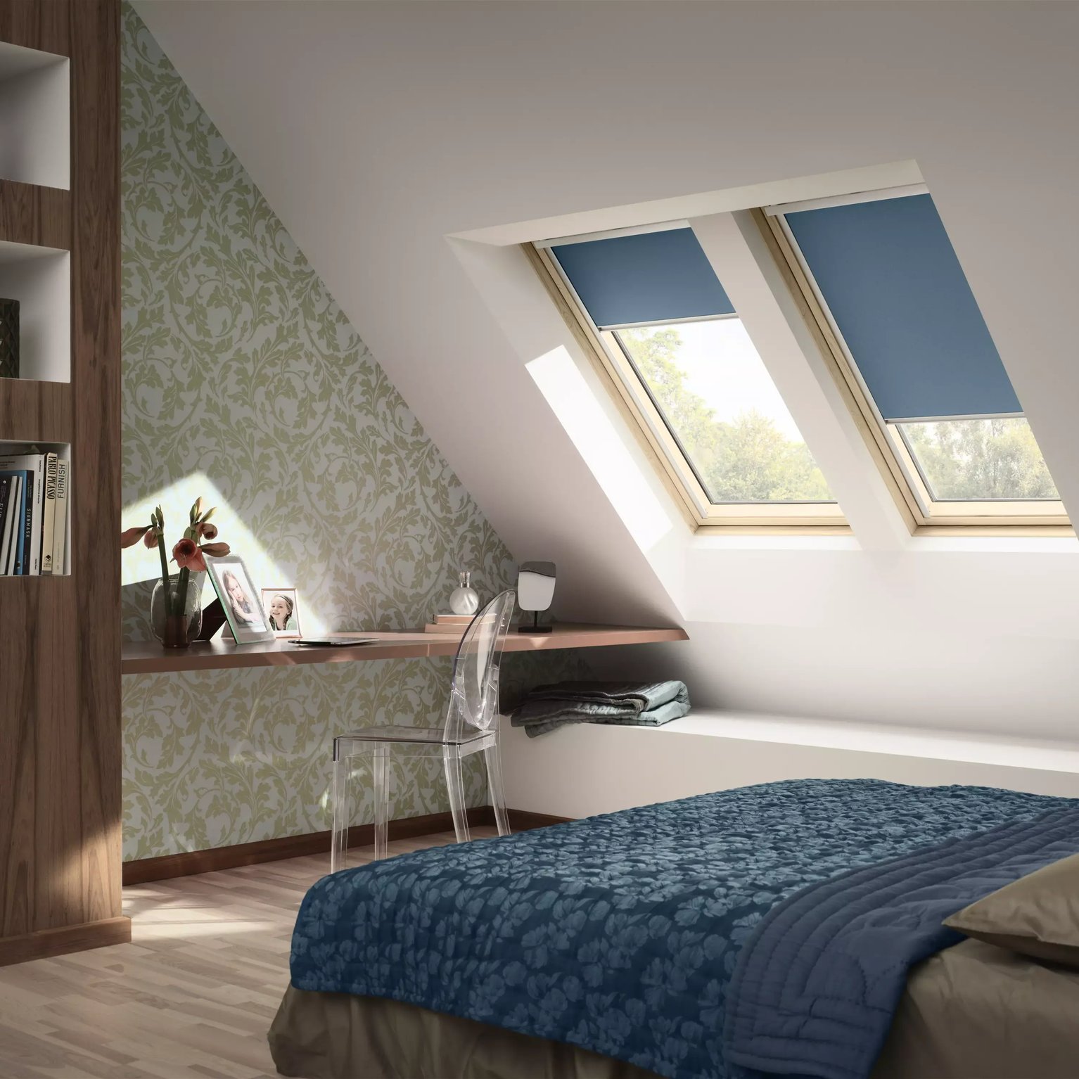 Attic bedroom with sloped ceiling and VELUX roof windows, cozy decor.